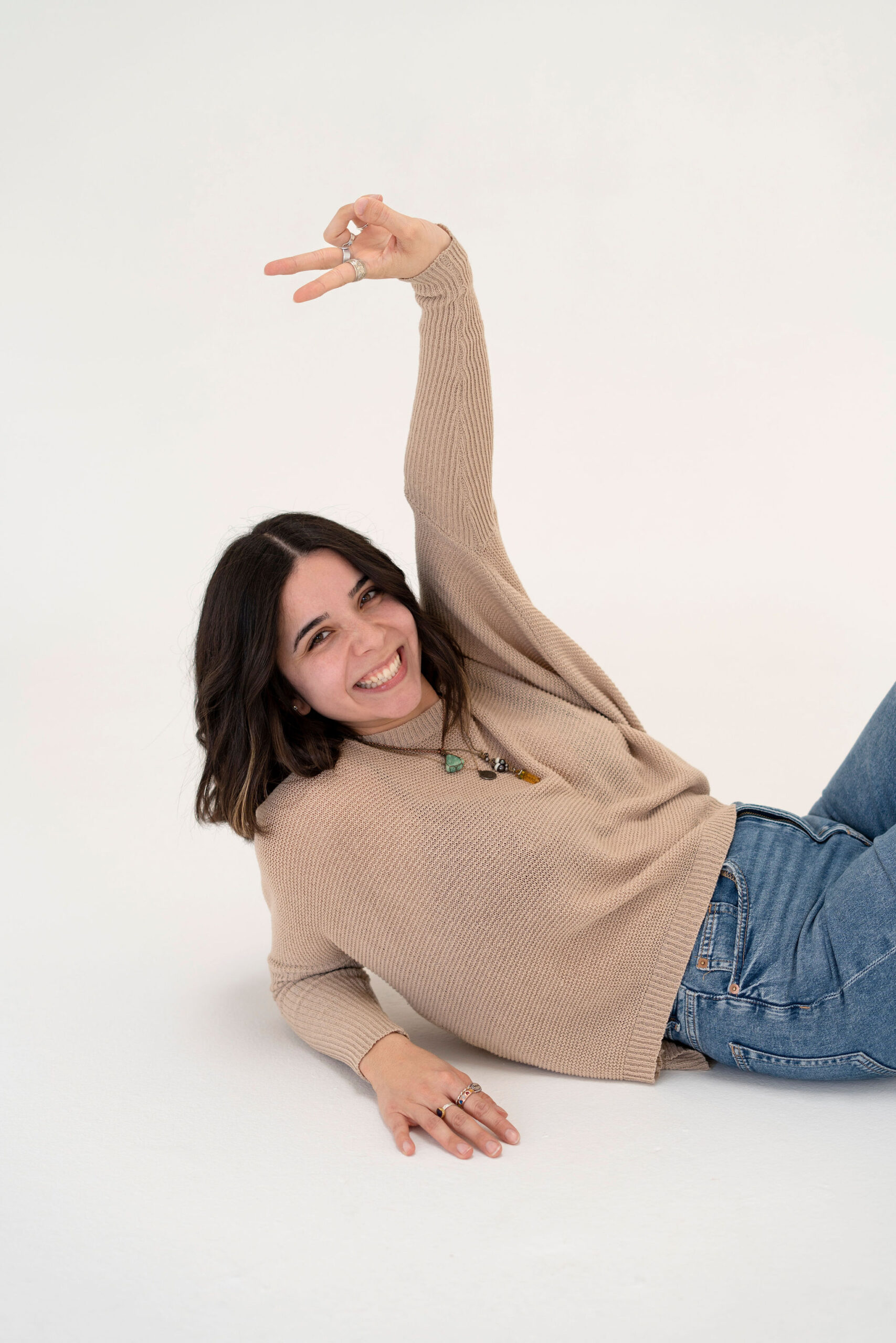 Pinterest and blogging manager Nicole Smiling on the ground posing
