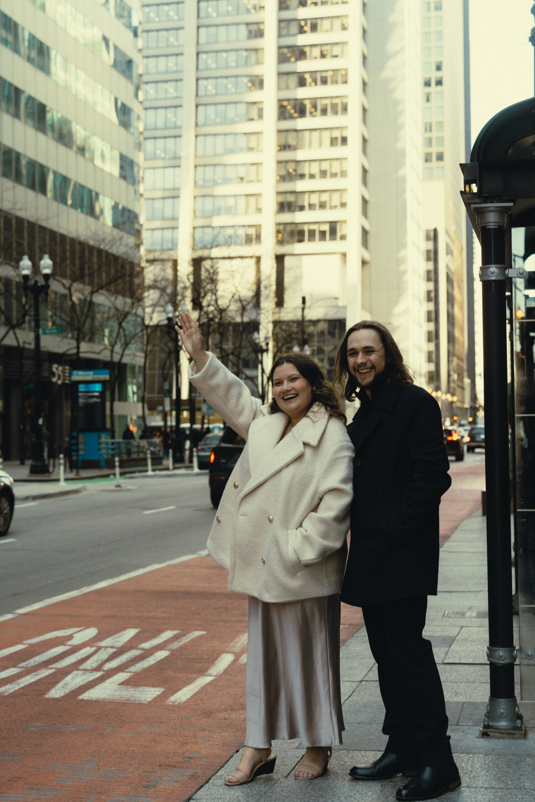 Priscilla from Kinfolk Creative flags down a taxi in Chicago with her fiance, Zach - the SEO guy.